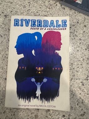 Scholastic Riverdale paperback with blue and pink silhouette cover
